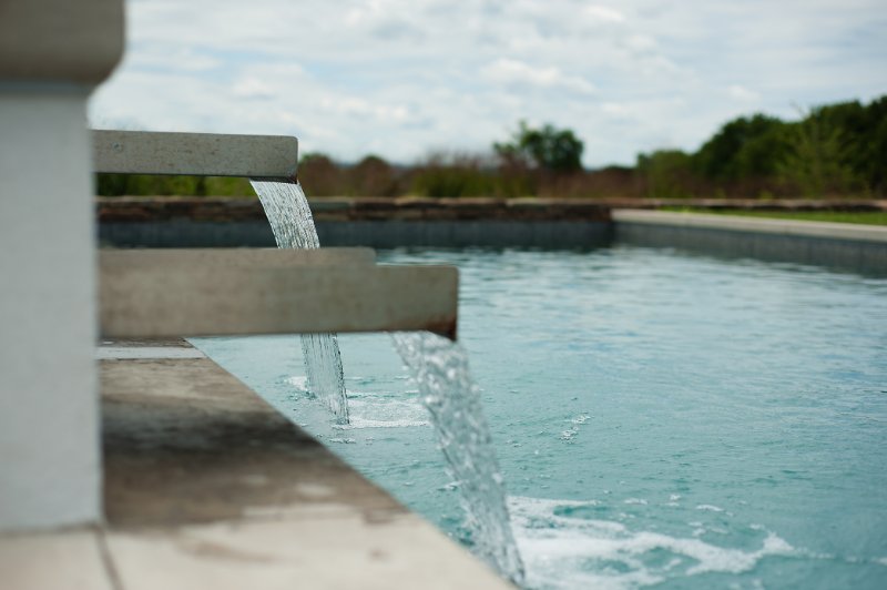 close up of waterfall effects from the hot tub to the pool