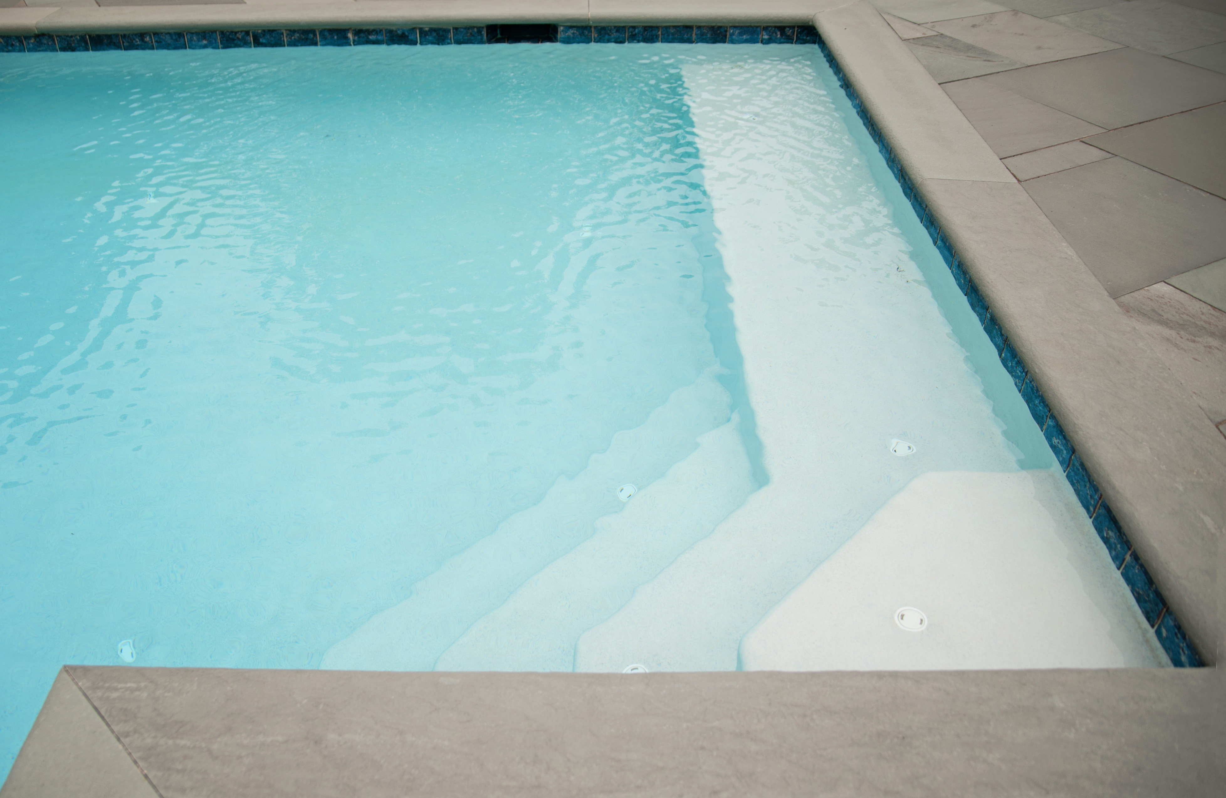angled cascading steps into serene pool