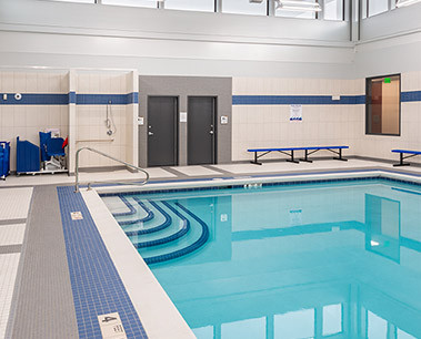 steps leading down into a indoor commercial pool