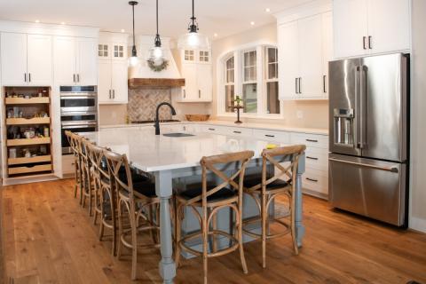 lakehouse kitchen with stainless appliances and white countertops