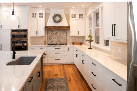 beautiful white kitchen with black trim
