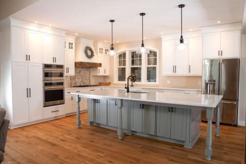 view of large gray island and white countertop
