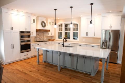 white countertop in kitchen with gray faucet