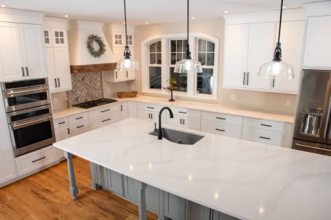 beautiful marbel countertops with stainless and black accents in kitchen