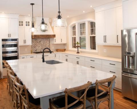beautiful kitchen with large marbled island and eat in kitchen