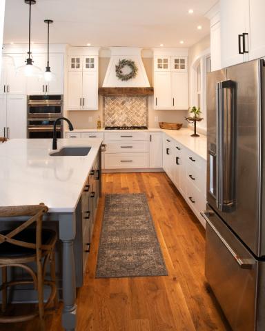 view of galley inbetween the wall and island in kitchen