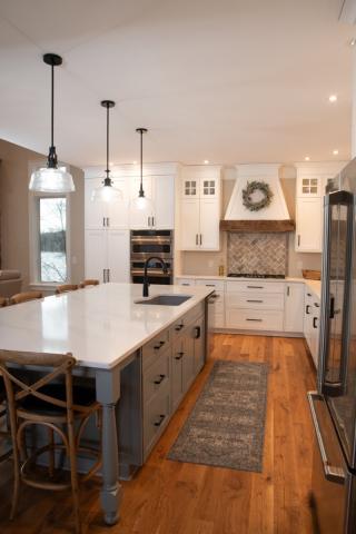 angle view of kitchen galley inbetween wall and sink and island