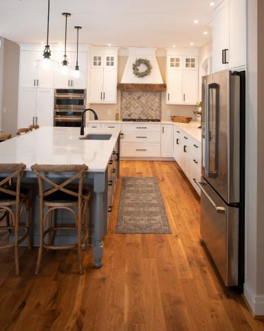 beautiful kitchen with eat in island and gray accents