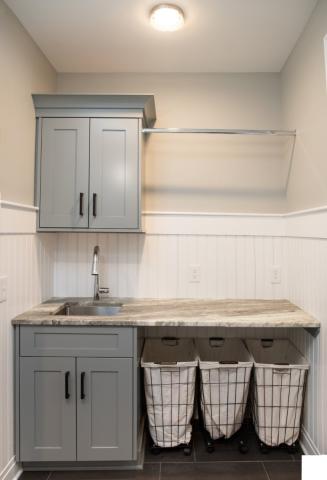 gray and marbled countertop laundry room