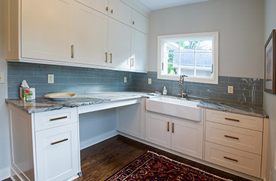 white wood and blue tile laundry room 