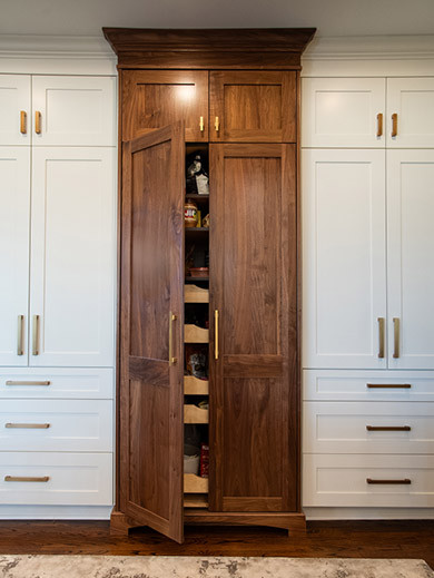 tall white and brrown kitchen cabinets
