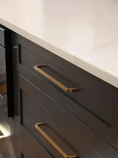 white countertop and dark brown cabinet