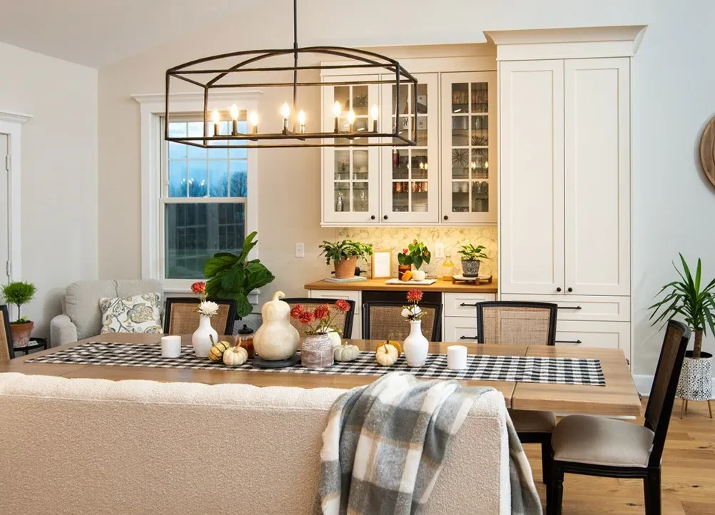 bright and cozy dining room with fall time decor