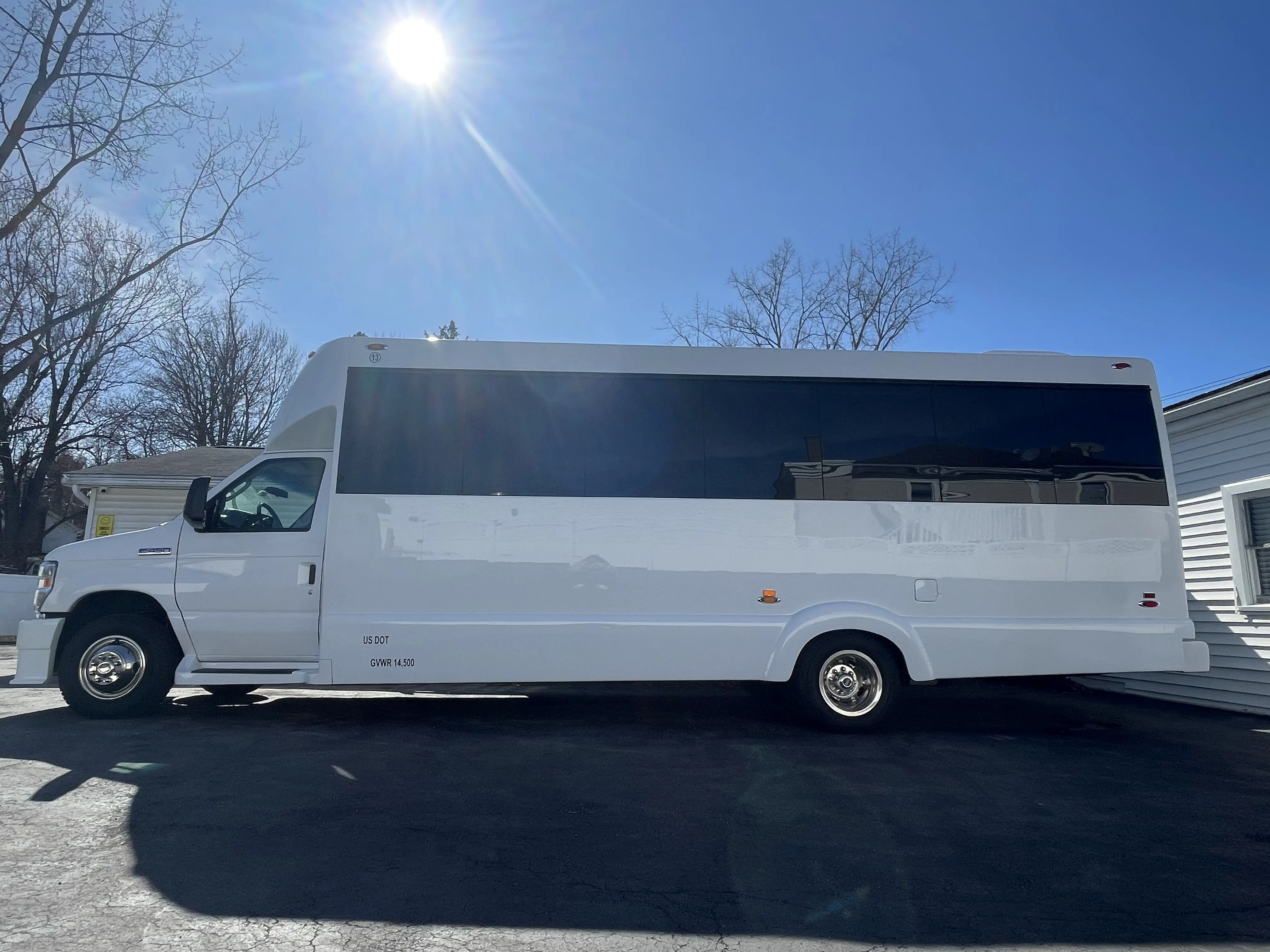 exterior from driver's side classy coach transportation limo bus