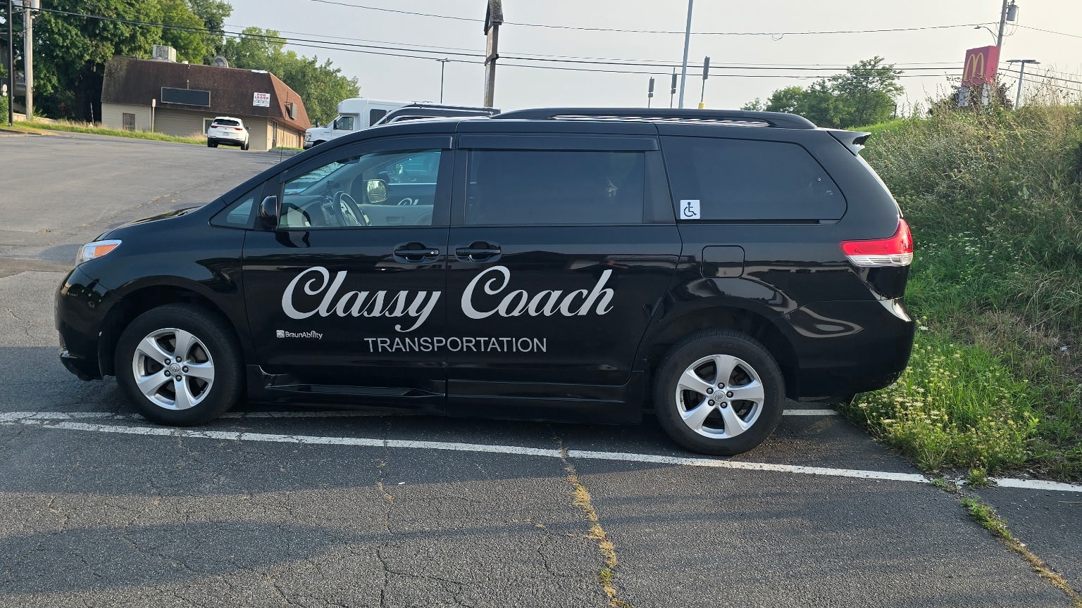 black wheelchair accessible minivan from classy coach NY