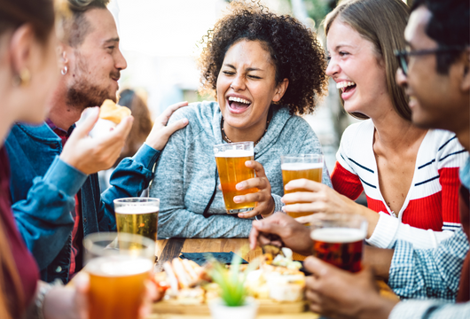 friends drinking beers at a table