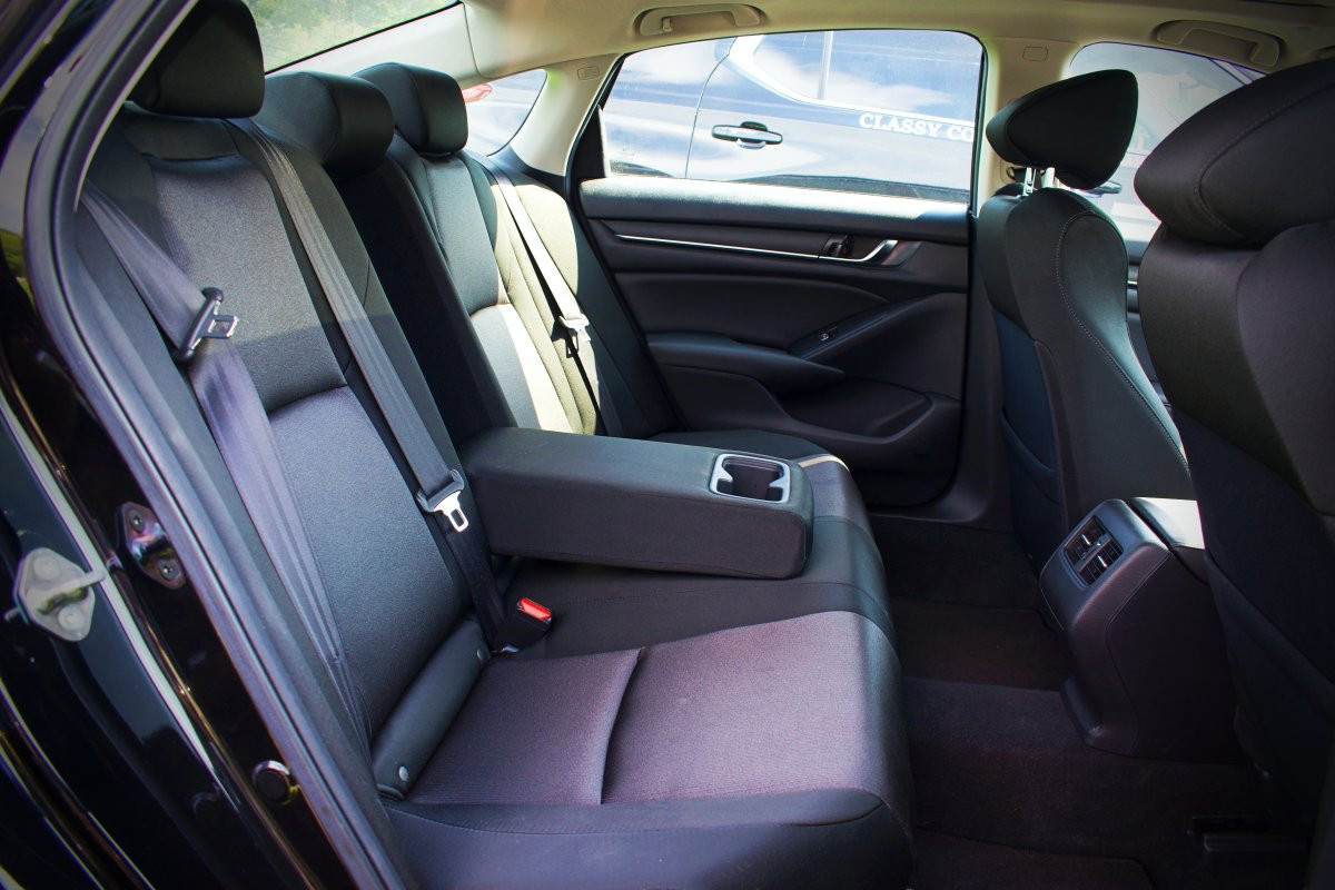 classy coach transportation black sedan backseat