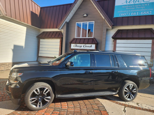 chevy black SUV from side angle