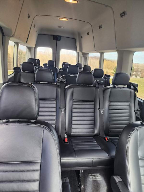 interior of black transit bus from classy coach transportation