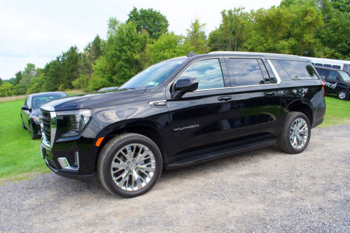 exterior of black classy coach yukon