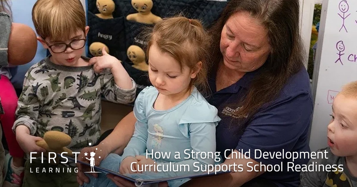 A teacher reads with young children in a classroom, supporting early learning and development.