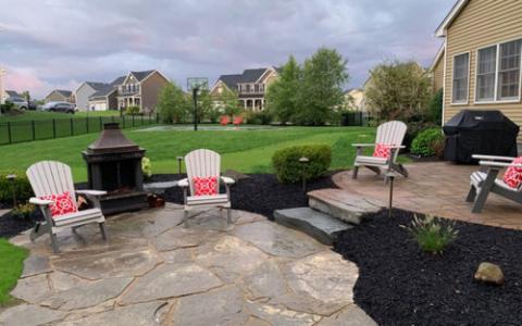grey adirondack chairs on a patio