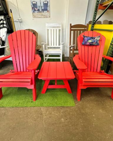 red adirondack chairs with a red table