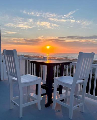 adirondack chairs and a sunset