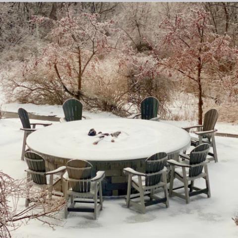 adirondack furniture covered in snow