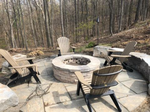 adirondack chairs around a firepit