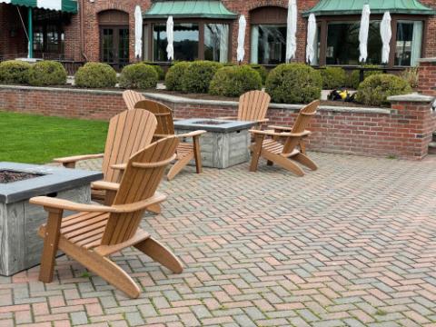 adirondack furniture on a brick patio