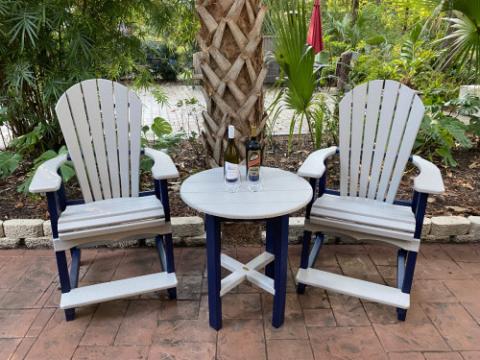 grey adirondack chairs with table