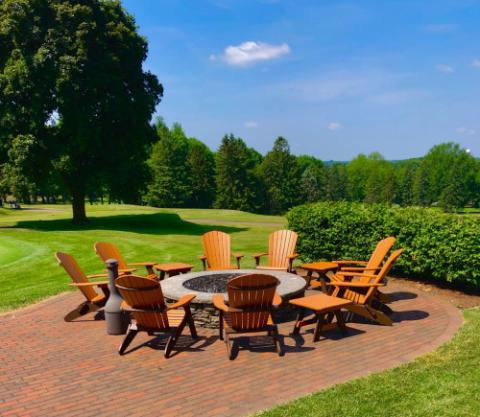 adirondack chairs around a firepit