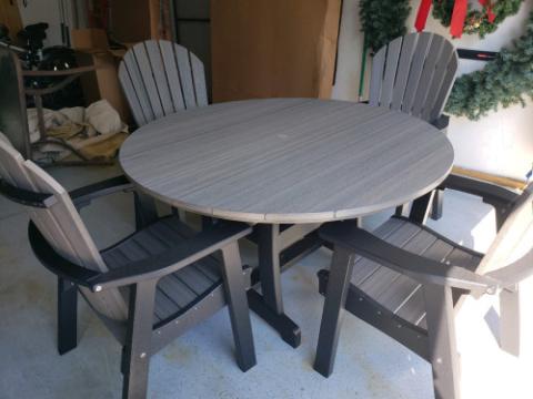 grey adirondack chairs and table
