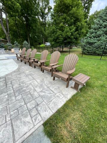 brown adirondack chairs on a patio