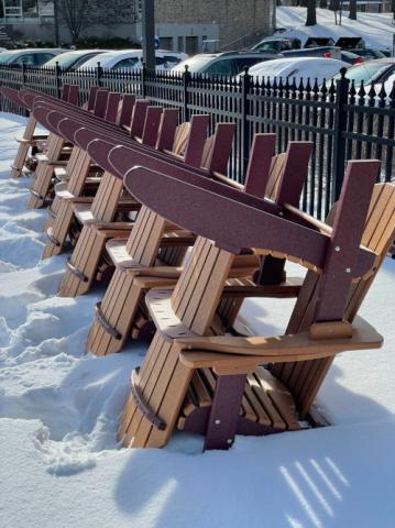 brown adirondack chairs stacked