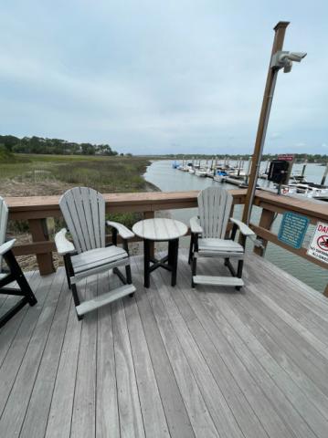 adirondack chairs with a grey table