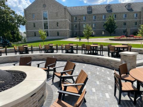 adirondack chairs around a fire pit
