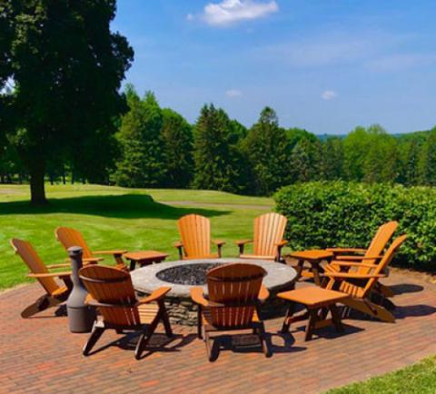 cedar adirondack chairs around a firepit