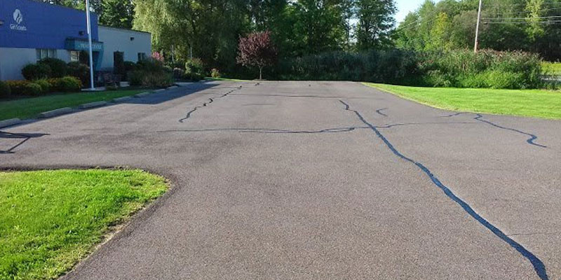 A parking lot outside of a Girl Scouts building.