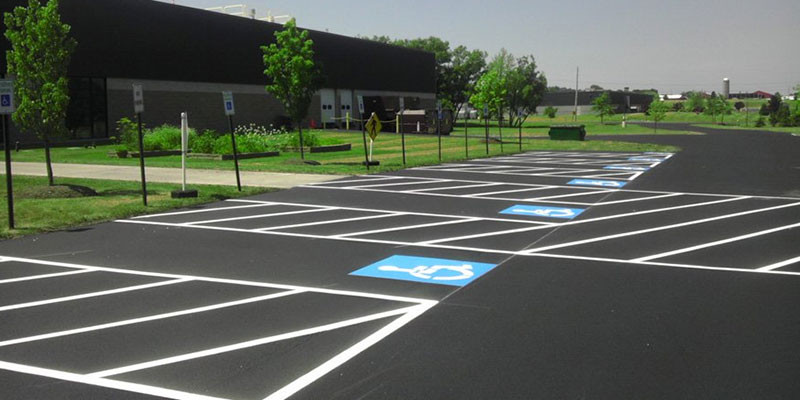 New line striping in a parking lot.