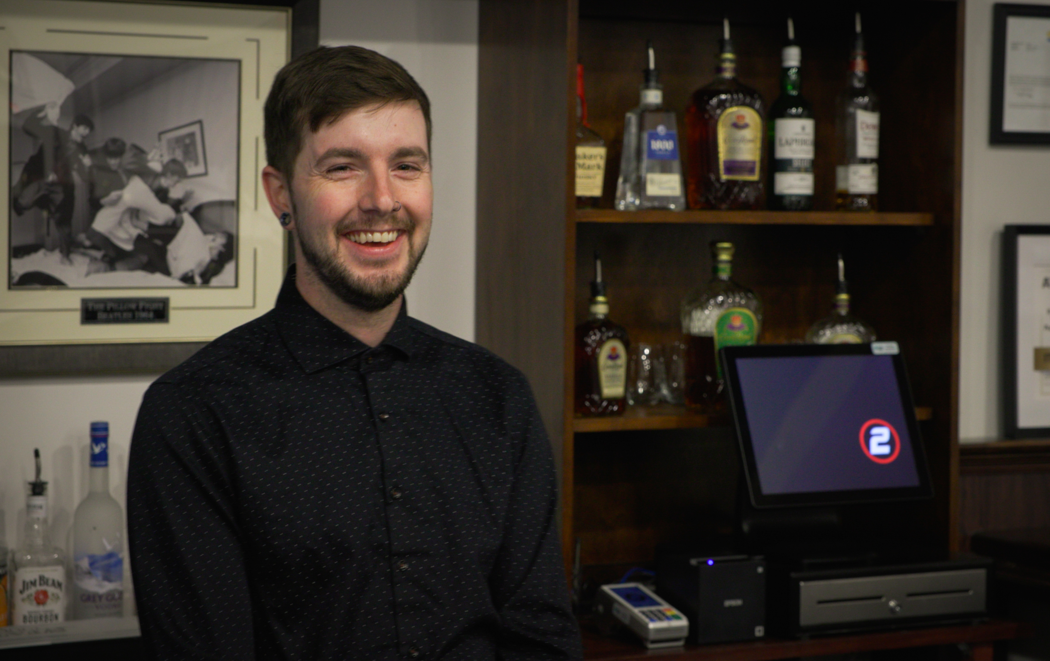 A brick building with a Butler Business Systems sign and large front windows.
