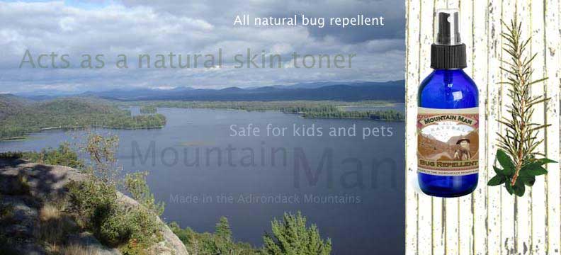 All natural bug bite repellent with mountain overlooking a lake