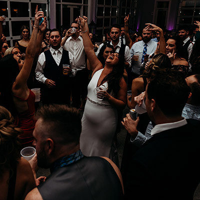 joyous crowd dancing and celebrating at a lively indoor party