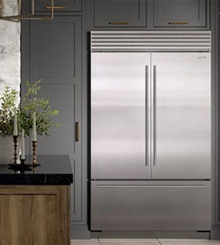 a room with a sink and a mirror