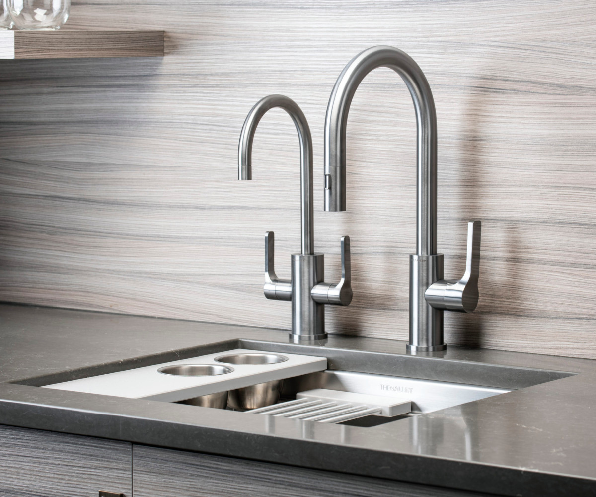 grey countertop kitchen sink with faucets