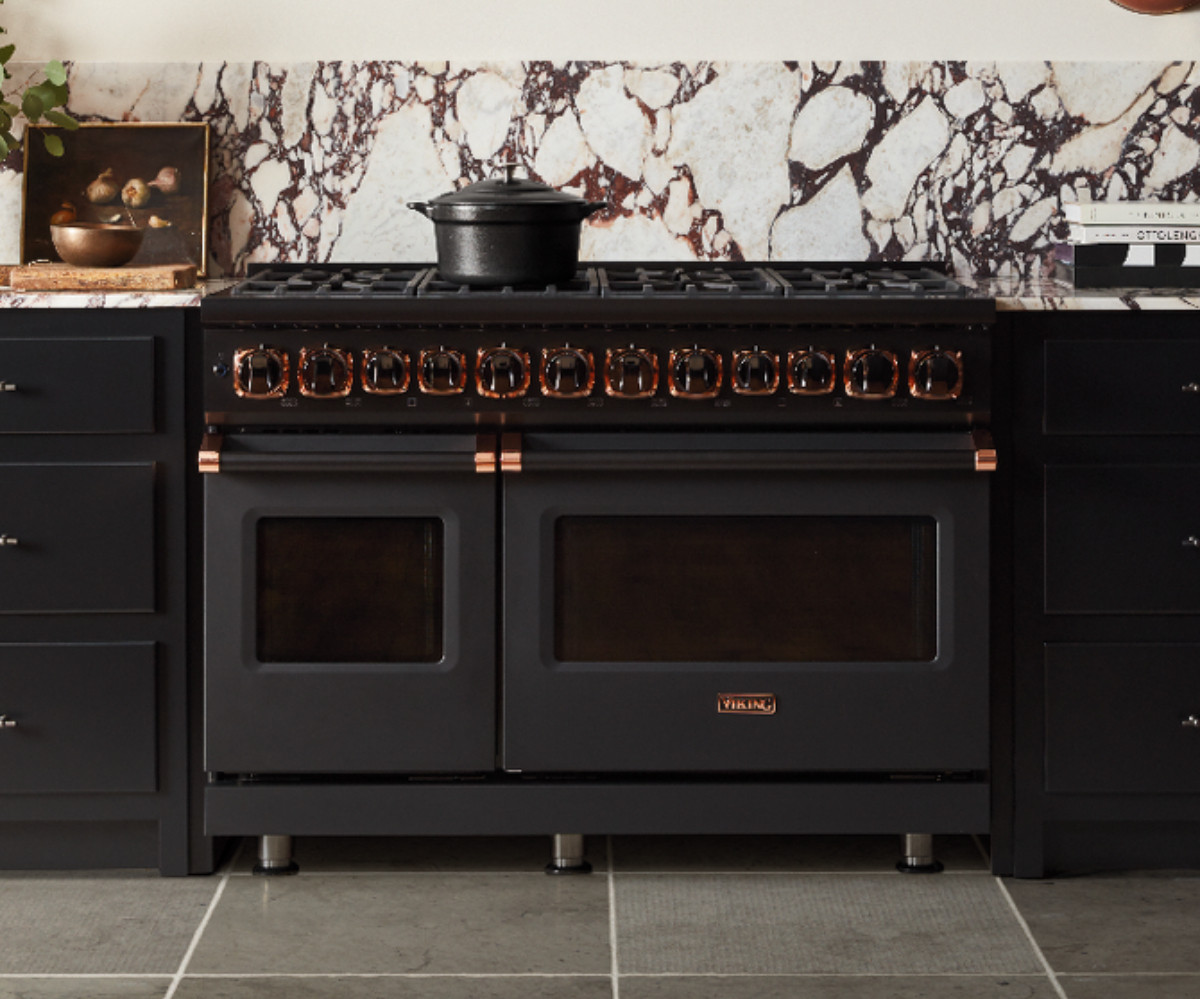 matte black oven with rose gold marble backsplash