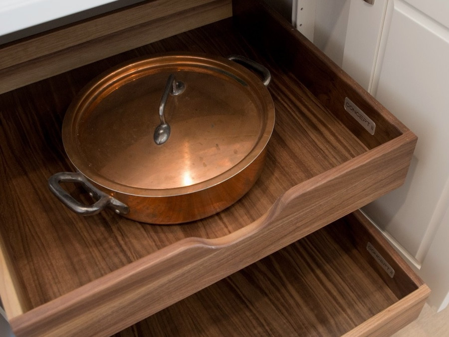 wooden kitchen drawer with copper pot