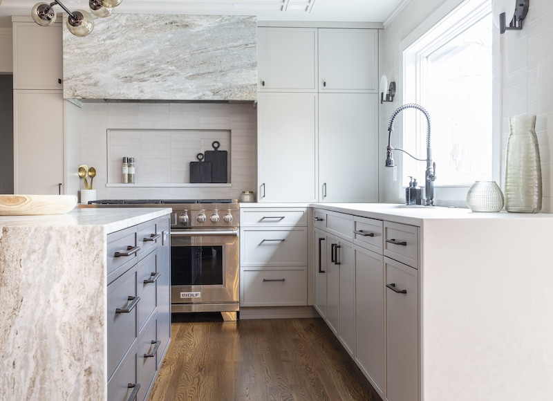 white and gray kitchen cabinets with marble