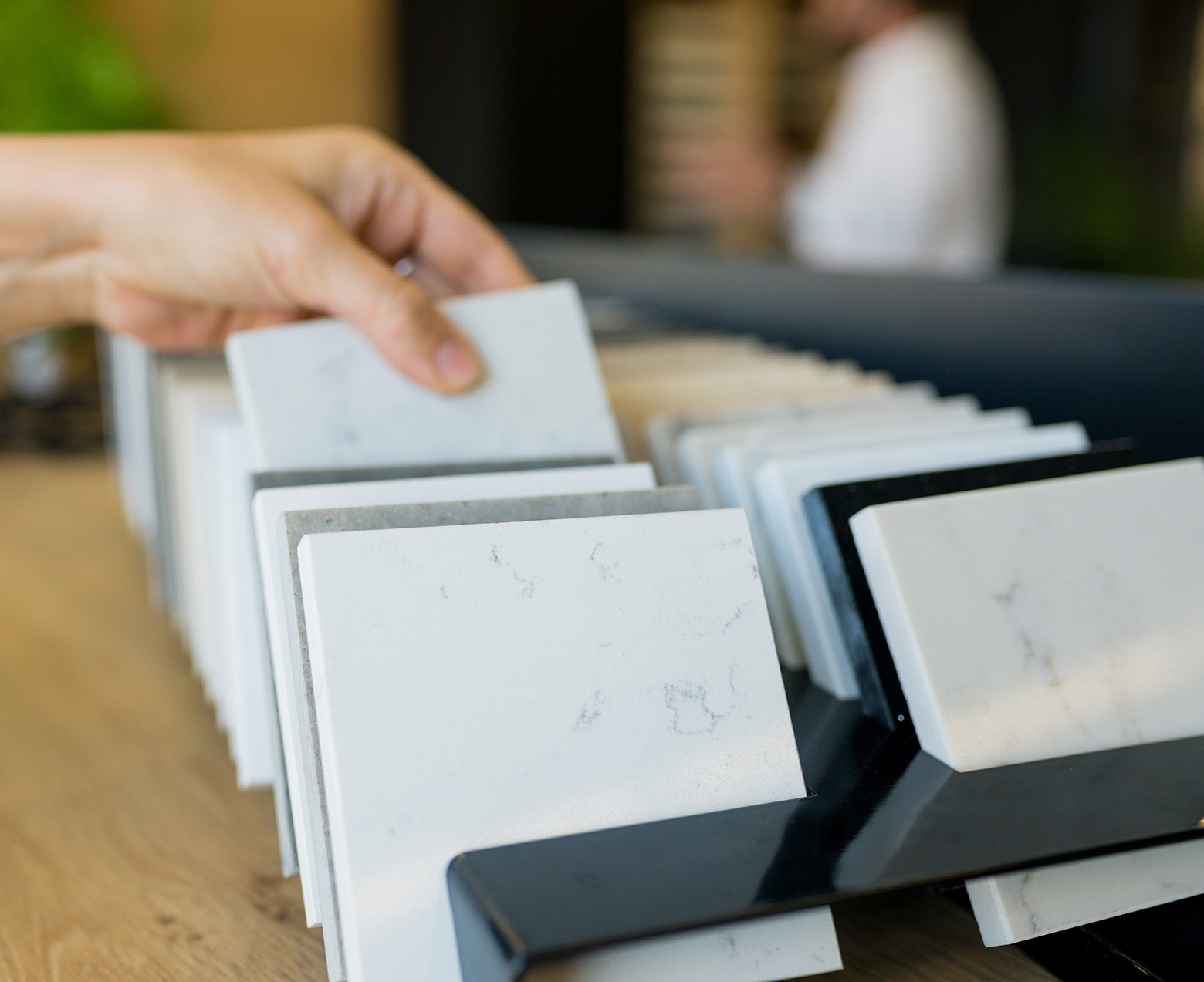 hand grabbing marble tile sample